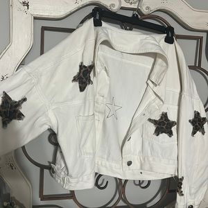 white blue jean jacket with cheeta print stars
